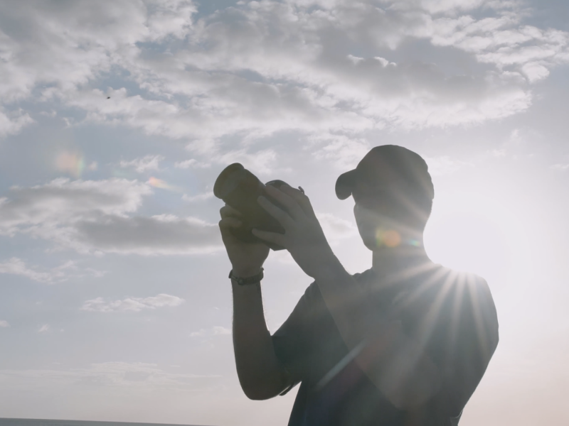an image of a man holding a camera